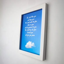 Load image into Gallery viewer, Framed (white) print of  Numbers 6:24-26 in white handwritten script on blue sky with one cloud