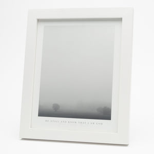 Black and white print of tree in fog with Psalm 46:10 at the bottom in a white frame
