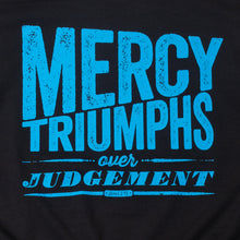 Load image into Gallery viewer, Close up of James 2:13, Mercy triumphs over judgement, modern textured design printed in light blue on black t shirt