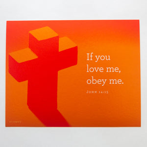 John 14:15, "If you love me, obey me." Printed on orange cross photo.