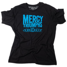 Load image into Gallery viewer, James 2:13, Mercy triumphs over judgement, modern textured design printed in light blue on black t shirt with Matthew 25:40 printed as the tag