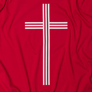 Close up of White Christian Cross with 3 vertical and 3 horizontal lines on red t shirt 