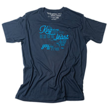 Load image into Gallery viewer, Matthew 25:40 printed in light blue on navy t shirt and as the tag