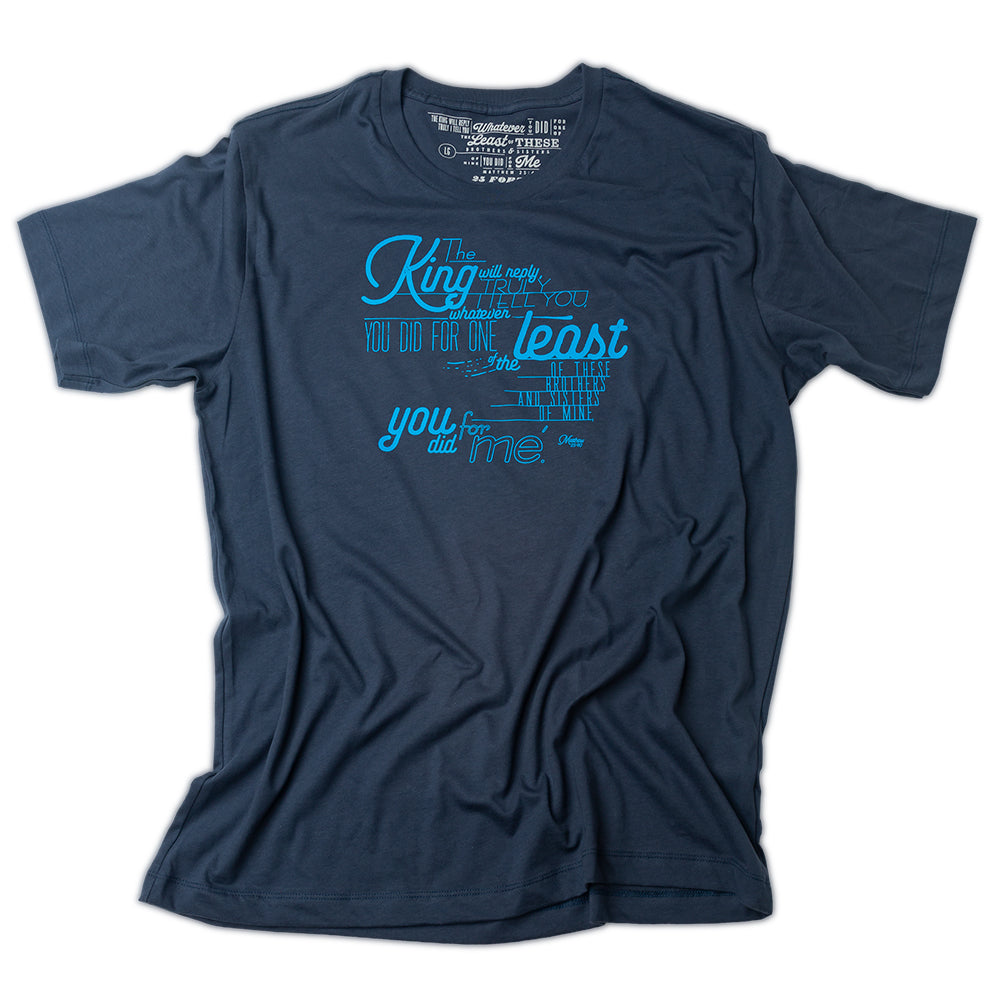 Matthew 25:40 printed in light blue on navy t shirt and as the tag