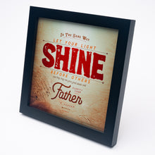 Load image into Gallery viewer, Metallic photo print with Matthew 5:16 in textured type with wooden background in black frame