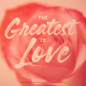 "The Greatest is Love" in pink in handwritten script. "And now these three remain: faith, hope and love. But the greatest of these is love." 1 Corinthians 13:13. Background is light pink with a single flower in the middle.