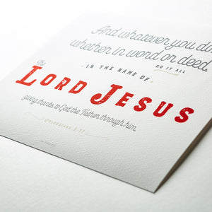 Close up of Colossians 3:17 printed in red, gray and tan on white fine art paper